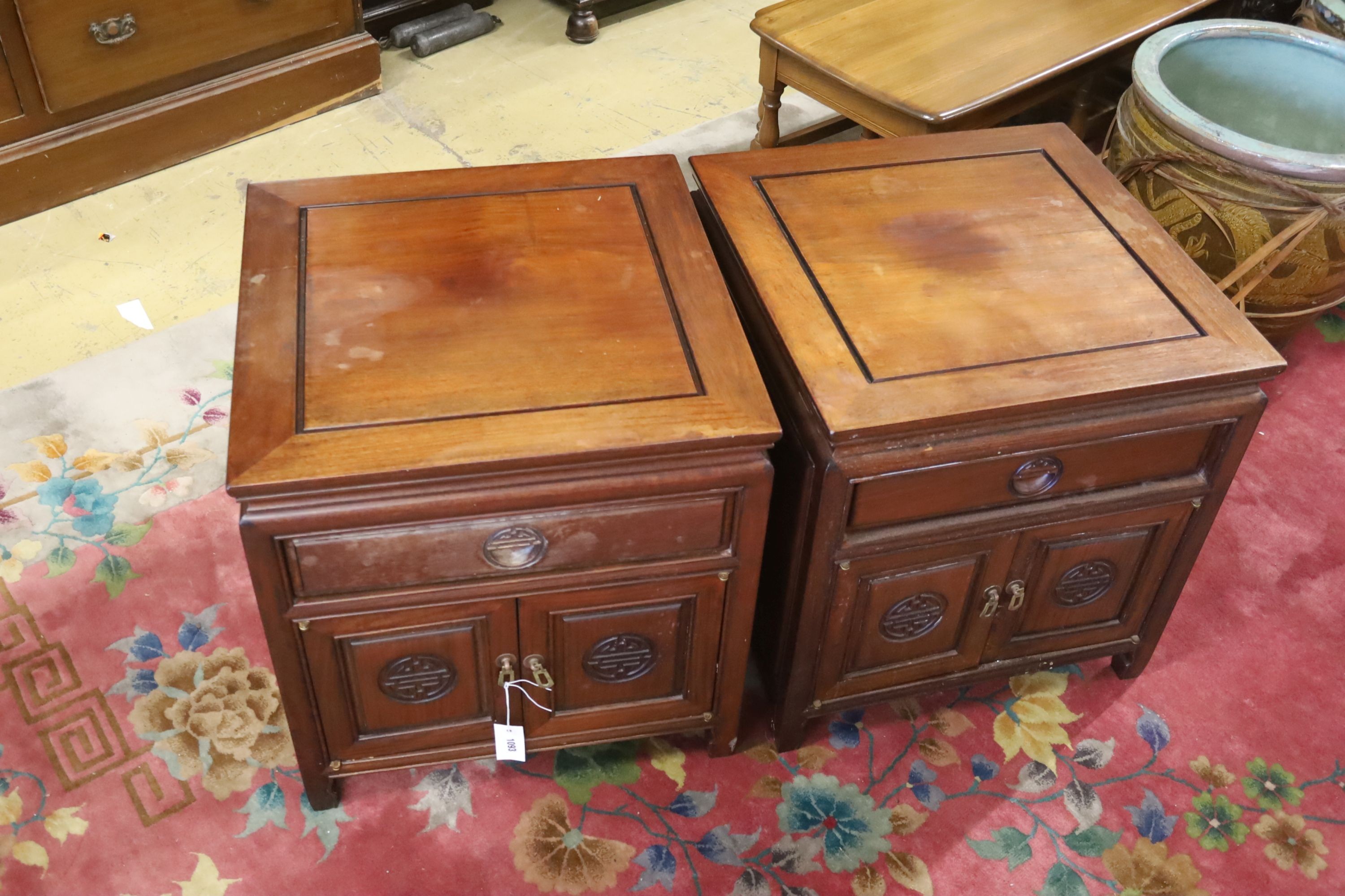 A pair of Chinese carved hardwood low cabinets, width 56cm, depth 56cm, height 59cm